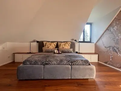 Ein Bett oder Betten in einem Zimmer der Unterkunft Trierer Heide - Architektur zum wohl fühlen