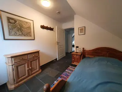 Ein Bett oder Betten in einem Zimmer der Unterkunft Großes Ferienhaus Sauerburgblick