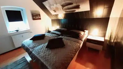 Ein Bett oder Betten in einem Zimmer der Unterkunft Ferienwohnung Am Vulkanpfad