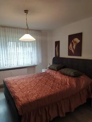 Ein Bett oder Betten in einem Zimmer der Unterkunft Sankt Goar EG, Schön gelegene Ferienwohnung