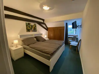 Ein Bett oder Betten in einem Zimmer der Unterkunft Weinzeit Kröv