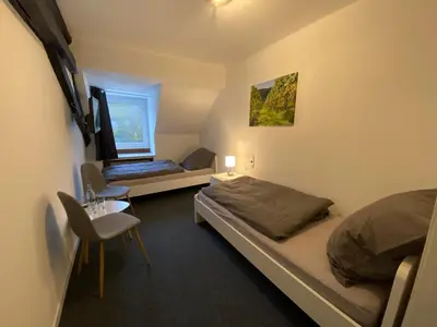 Ein Bett oder Betten in einem Zimmer der Unterkunft Weinzeit Kröv