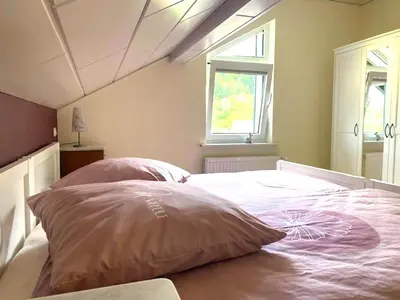 Ein Bett oder Betten in einem Zimmer der Unterkunft Jünkerath Romantic Garden Stay