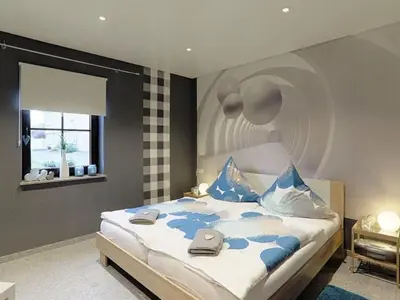 Ein Bett oder Betten in einem Zimmer der Unterkunft Holiday Home in Gönnersdorf near Badesee