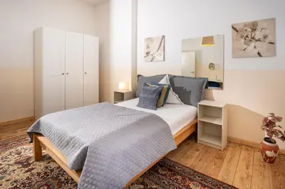 Ein Bett oder Betten in einem Zimmer der Unterkunft Charmante Privatzimmer in der Stadt