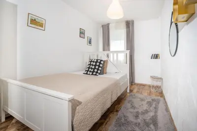Ein Bett oder Betten in einem Zimmer der Unterkunft Charmante Privatzimmer in der Stadt