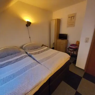 Ein Bett oder Betten in einem Zimmer der Unterkunft Zur alten Metzgerei