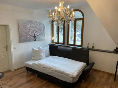 Ein Bett oder Betten in einem Zimmer der Unterkunft FEWO Hühnerberg Weingut C.A. Haussmann