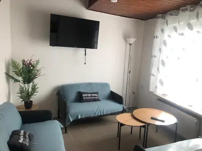 Ein Sitzbereich in der Unterkunft Ferienhaus Herzblume