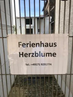 Ein Zertifikat, Auszeichnung, Logo oder anderes Dokument, das in der Unterkunft Ferienhaus Herzblume ausgestellt ist