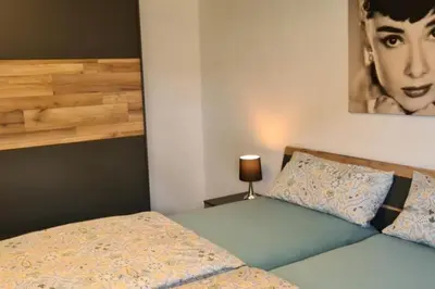 Ein Bett oder Betten in einem Zimmer der Unterkunft NEU! Ferienwohnung Eulennest