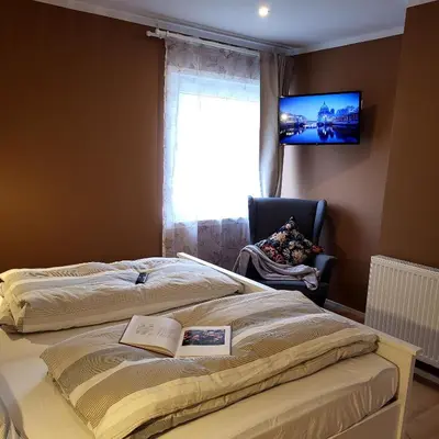 Ein Bett oder Betten in einem Zimmer der Unterkunft Haus Valentonio