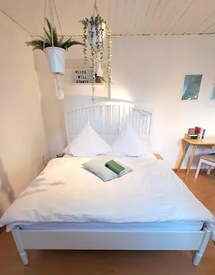 Ein Bett oder Betten in einem Zimmer der Unterkunft liebenswertes Apartment 10 Minuten zur Altstadt