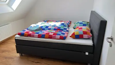 Ein Bett oder Betten in einem Zimmer der Unterkunft Ruim Familiehuis - 10 pers - Nabij Cochem-Zell, De Moezel & Calmont Klettersteig