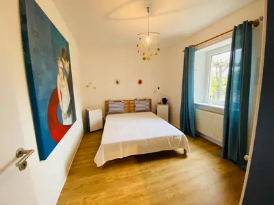 Ein Bett oder Betten in einem Zimmer der Unterkunft NEU! Ferienwohnung Atelier 7