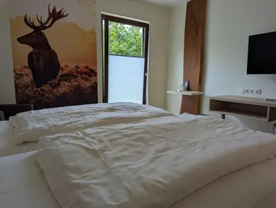 Ein Bett oder Betten in einem Zimmer der Unterkunft Jagdhaus Rech - Ahr