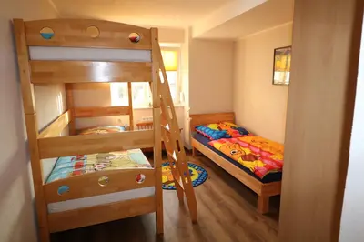 Ein Bett oder Betten in einem Zimmer der Unterkunft Ferienwohnung Am Pfaffenderbach