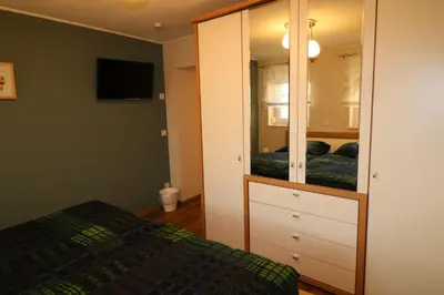 Ein Bett oder Betten in einem Zimmer der Unterkunft Ferienwohnung Am Pfaffenderbach