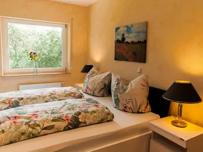 Ein Bett oder Betten in einem Zimmer der Unterkunft Ferienhaus Maring