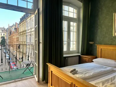 Ein Bett oder Betten in einem Zimmer der Unterkunft Nostalgie Altstadthotel Kornpforte