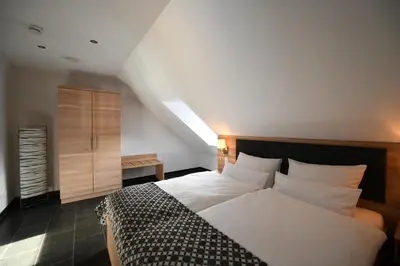 Ein Bett oder Betten in einem Zimmer der Unterkunft Weingut Heinen