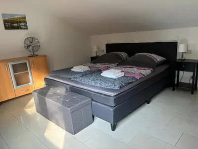 Ein Bett oder Betten in einem Zimmer der Unterkunft Ferienwohnung an der Mosel