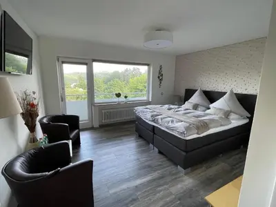 Ein Bett oder Betten in einem Zimmer der Unterkunft Gästehotel Lucendi Premium Lounge