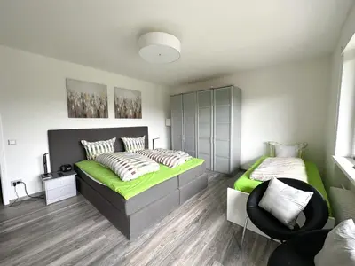 Ein Bett oder Betten in einem Zimmer der Unterkunft Gästehotel Lucendi Premium Lounge