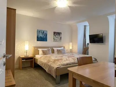 Ein Bett oder Betten in einem Zimmer der Unterkunft Zum Simonbräu