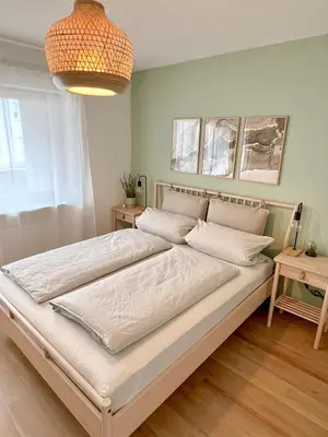 Ein Bett oder Betten in einem Zimmer der Unterkunft JUPAS - Premium Apartments Trier