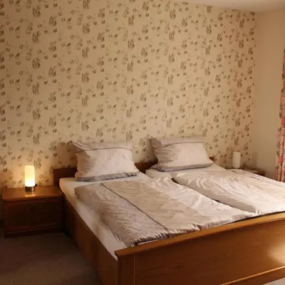 Ein Bett oder Betten in einem Zimmer der Unterkunft Ferienwohnung Mietzner