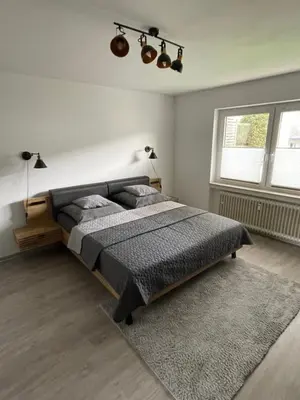 Ein Bett oder Betten in einem Zimmer der Unterkunft Ferienwohnung LauterWein