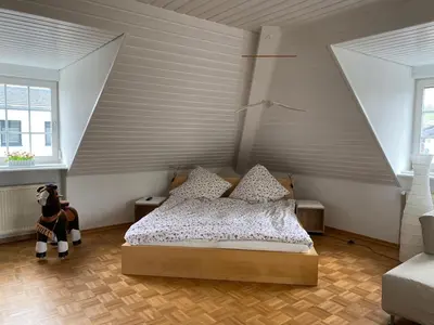 Ein Bett oder Betten in einem Zimmer der Unterkunft Ferienwohnung WERTevoll