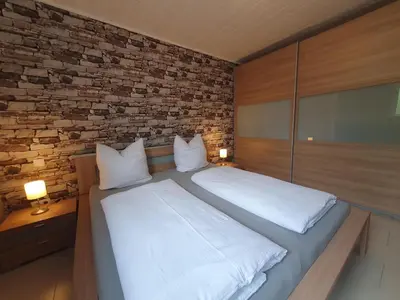 Ein Bett oder Betten in einem Zimmer der Unterkunft Ferienwohnung Moselglück