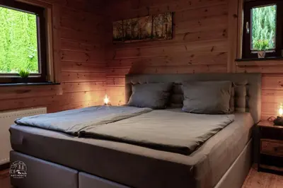 Ein Bett oder Betten in einem Zimmer der Unterkunft Holzblockhaus, Eifel