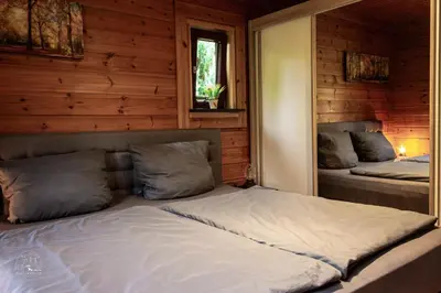 Ein Bett oder Betten in einem Zimmer der Unterkunft Holzblockhaus, Eifel