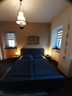 Ein Bett oder Betten in einem Zimmer der Unterkunft Ferienwohnung Anno1880