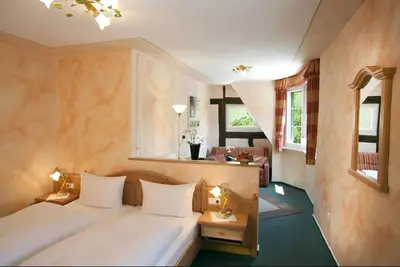 Ein Bett oder Betten in einem Zimmer der Unterkunft Gästehaus Zur Traube