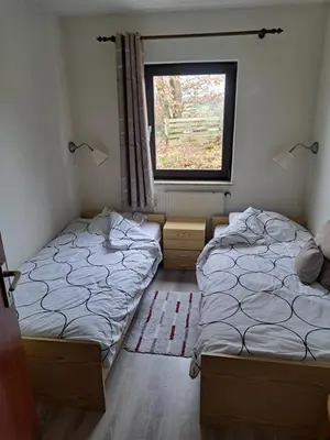 Ein Bett oder Betten in einem Zimmer der Unterkunft Haus Eifelblick