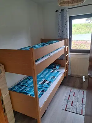Ein Bett oder Betten in einem Zimmer der Unterkunft Haus Eifelblick