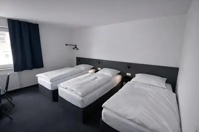 Ein Bett oder Betten in einem Zimmer der Unterkunft Zzzimple - Self Check-In